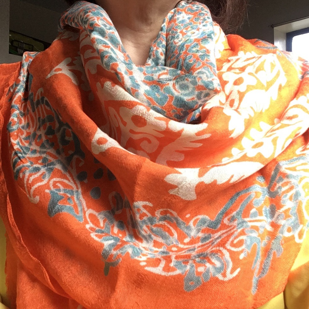 Light orange scarf with white flower